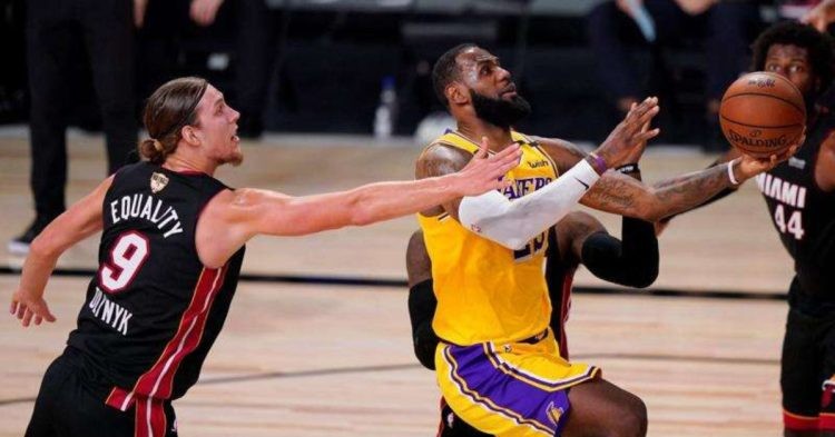 LA Lakers's LeBron James drives to the basket past Miami Heat's Kelly Olynyk