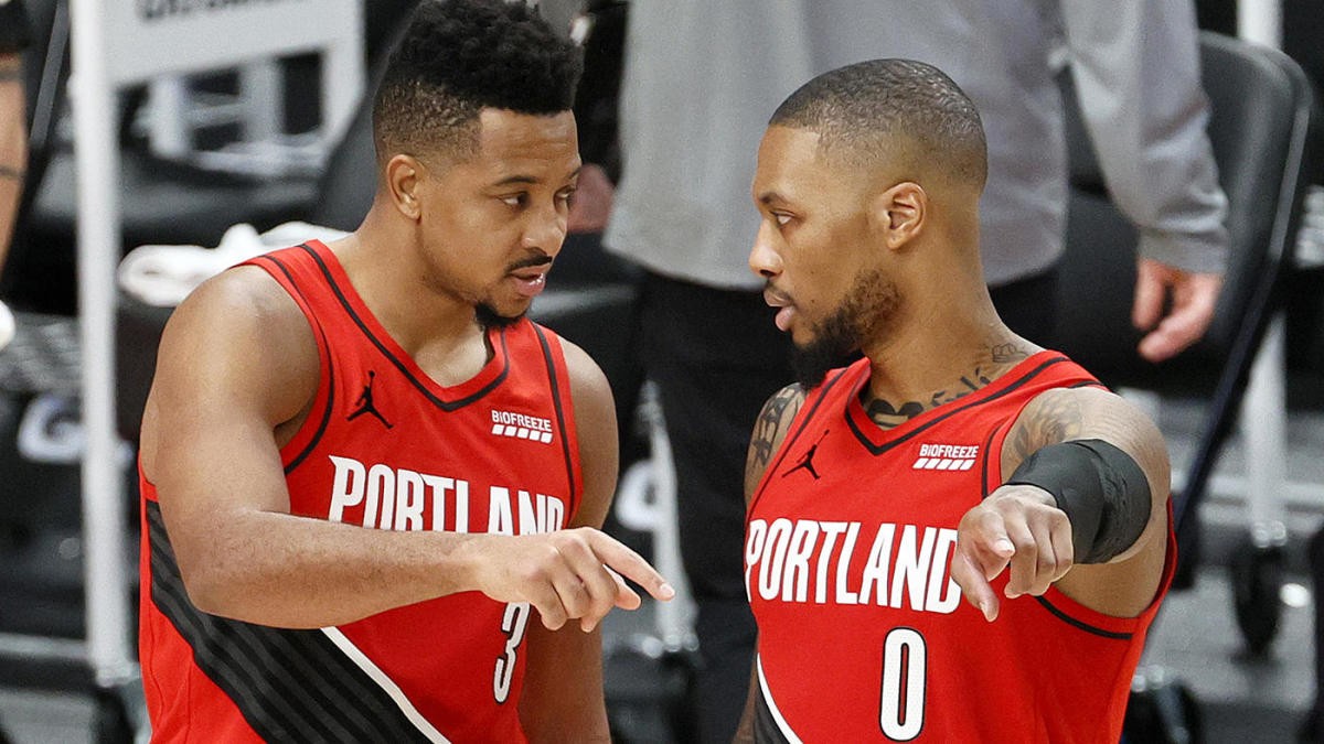 PORTLAND, OREGON - DECEMBER 26: CJ McCollum #3 and Damian Lillard #0 of the Portland Trail Blazers during the fourth quarter against the Houston Rockets at Moda Center on December 26, 2020 in Portland, Oregon. NOTE TO USER: User expressly acknowledges and agrees that, by downloading and/or using this photograph, user is consenting to the terms and conditions of the Getty Images License Agreement. (Photo by Steph Chambers/Getty Images)
