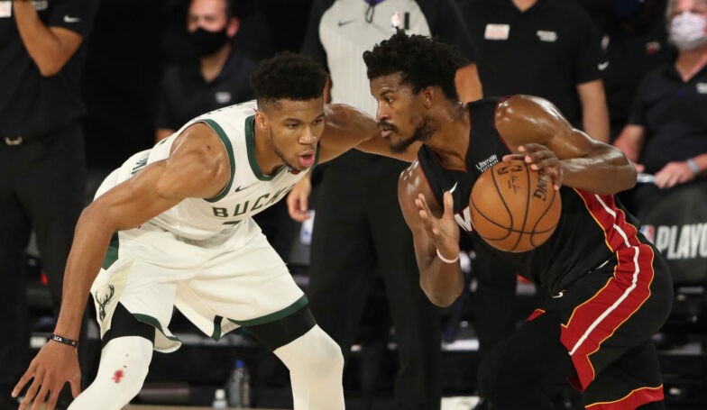 Orlando, FL - SEPTEMBER 4: Giannis Antetokounmpo #34 of the Milwaukee Bucks plays defense against Jimmy Butler #22 of the Miami Heat during Game Three of the Eastern Conference Semifinals on September 4, 2020 in Orlando, Florida at The Field House. NOTE TO USER: User expressly acknowledges and agrees that, by downloading and/or using this Photograph, user is consenting to the terms and conditions of the Getty Images License Agreement. Mandatory Copyright Notice: Copyright 2020 NBAE (Photo by Nathaniel S. Butler/NBAE via Getty Images)