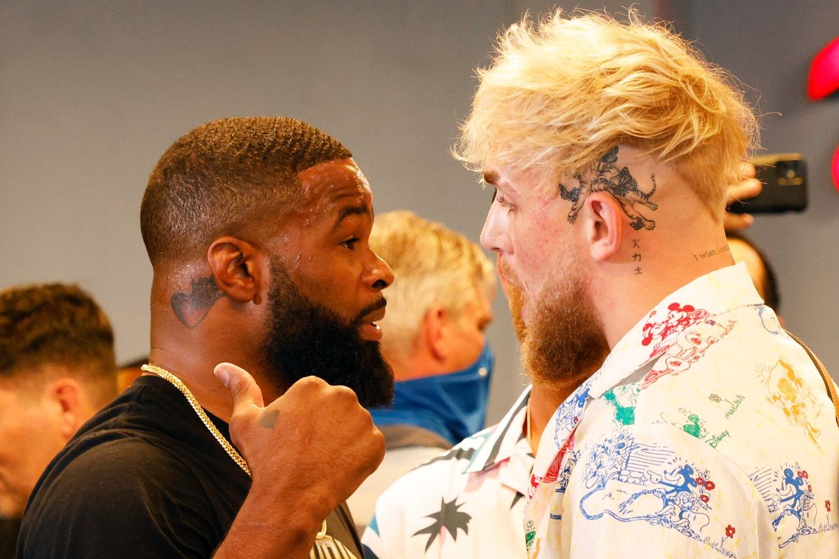 Jake Paul and Tyron Wodley square off at a media event