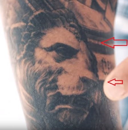 TJ Dillashaw lion tattoo