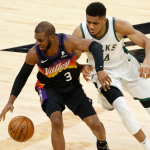 Chris Paul and Giannis Antetokounmpo fighting for the ball