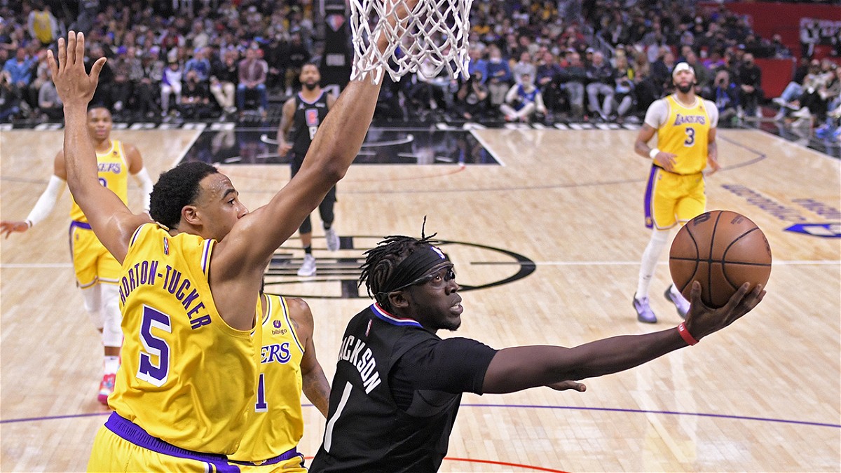 Los Angeles Clippers guard Reggie Jackson, right, shoots as Los Angeles Lakers guard Talen Horton-Tucker defends during the second half of an NBA basketball game Thursday, Feb. 3, 2022, in Los Angeles. (AP Photo/Mark J. Terrill)