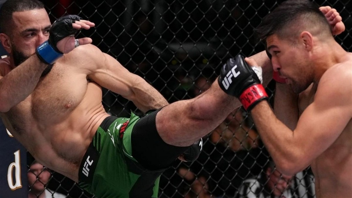 Belal Muhammad lands a high kick against Vicente Luque