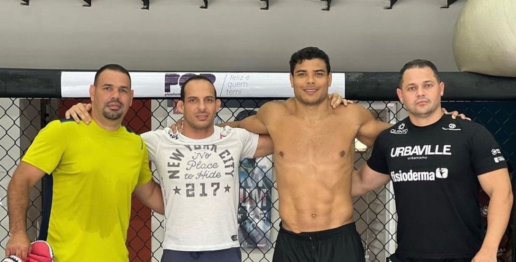 Kelson Pinto with Paulo Costa