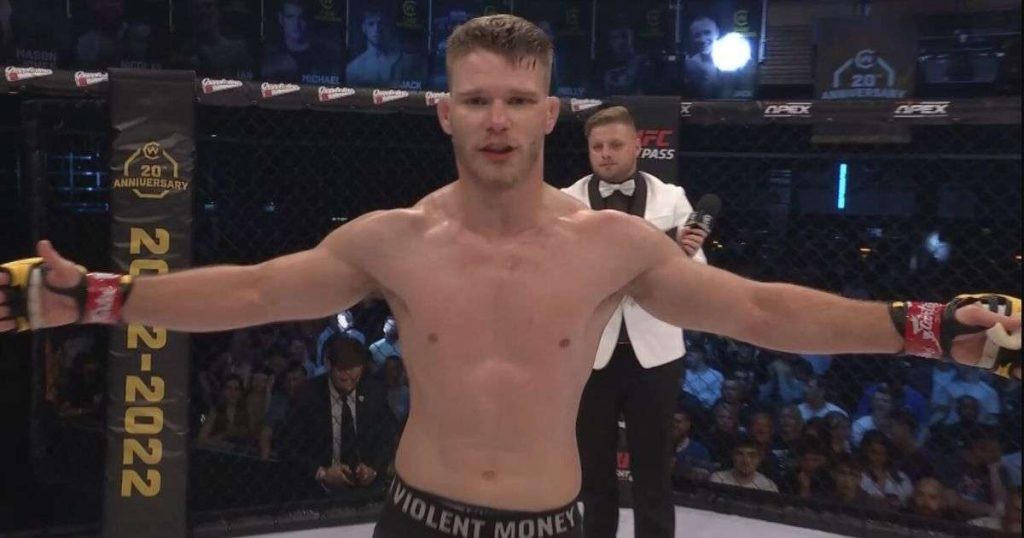 Michal Figlak celebrates a victory at Cage Warriors. 