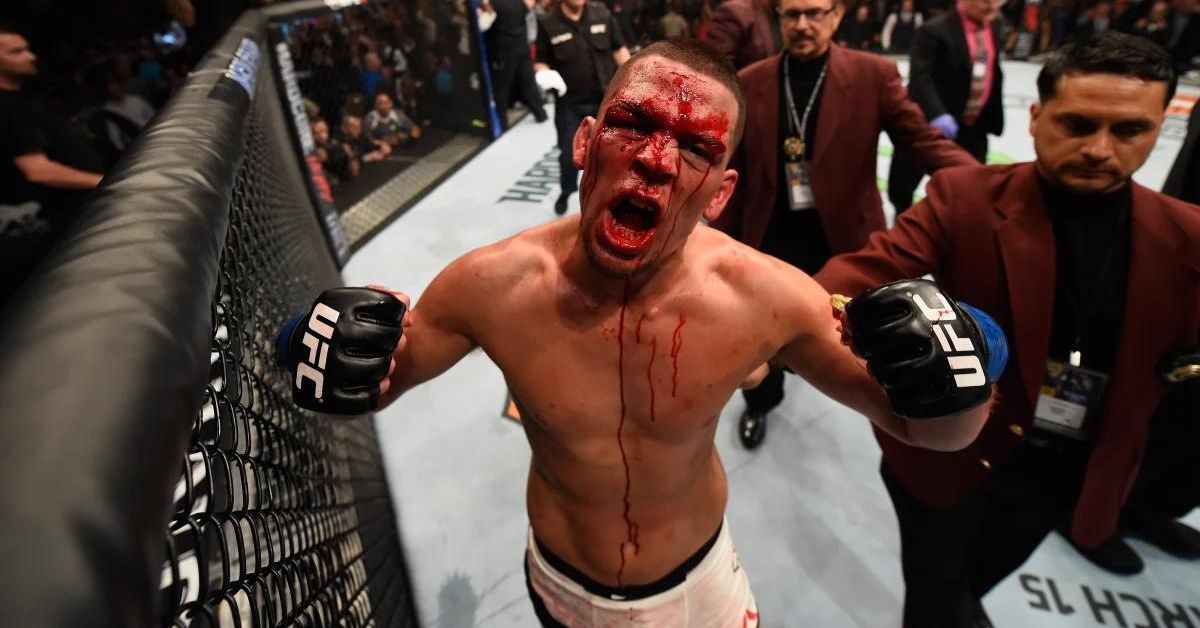 Nate Diaz flexes after beating Conor McGregor