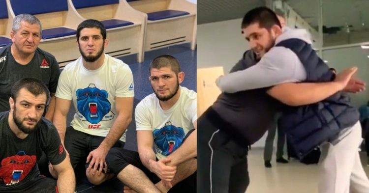 Islam Makhachev poses for a picture with Khabib and Abdulmanap Nurmagomedov