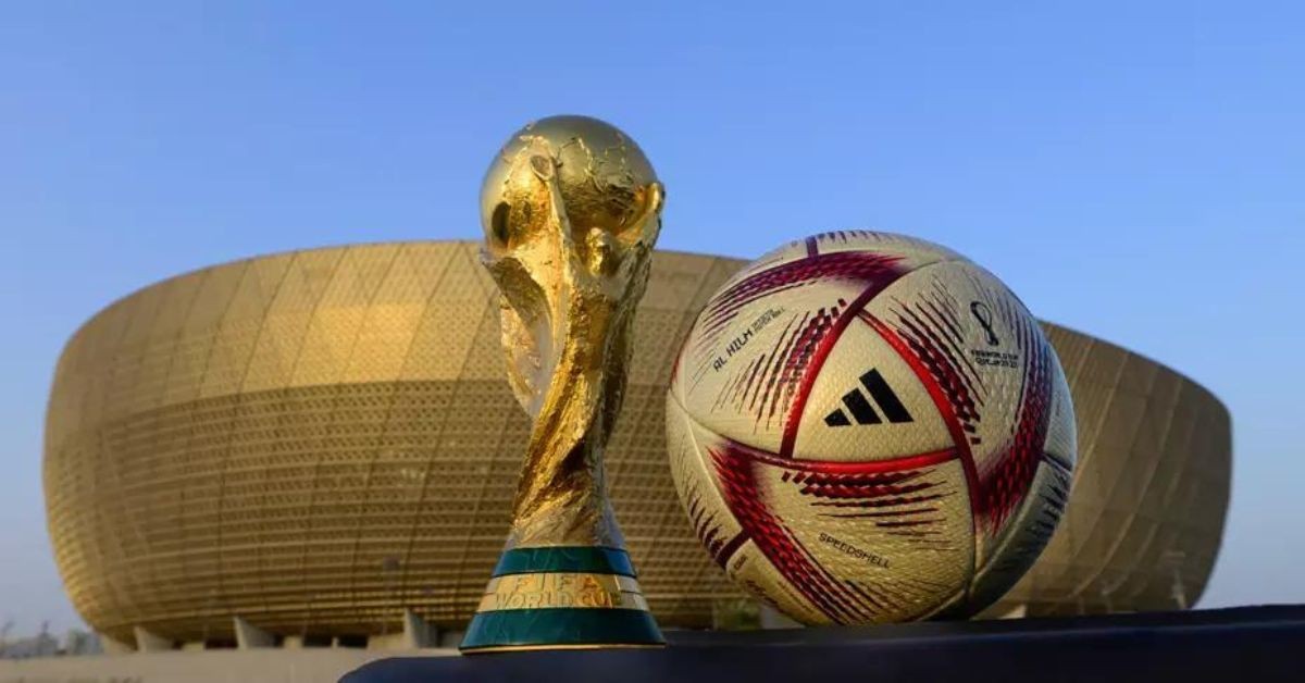 A picture of the new 'Al Hilm' ball, the World Cup trophy and the Lusail Stadium
