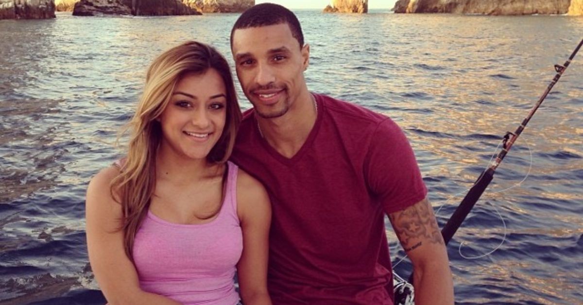 George Hill and his wife Samantha sitting in front of a lake