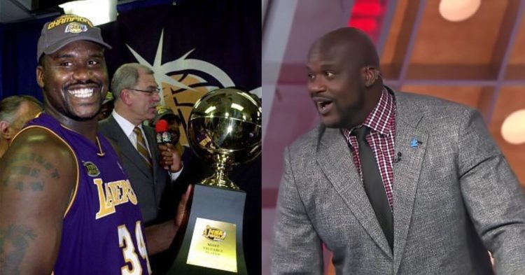 Shaquille O'Neal holding the trophy and wearing a suit