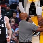 Los Angeles Lakers' Anthony Davis and San Antonio Spurs Jakob Poeltl on the court