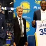 Bob Myers in a suit and with Kevin Durant and Steve Kerr