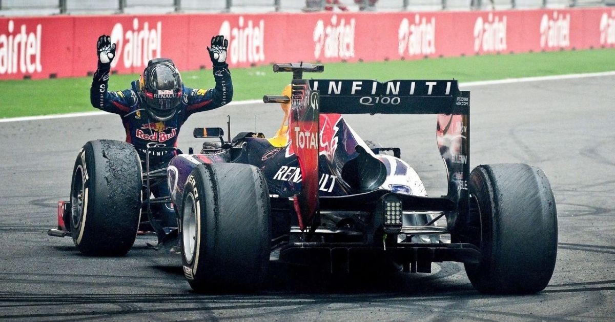 Sebastian Vettel bowing to his Red Bull car 1 1
