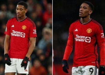 Anthony Martial wearing a manchester united jersey, sad, disappointed.