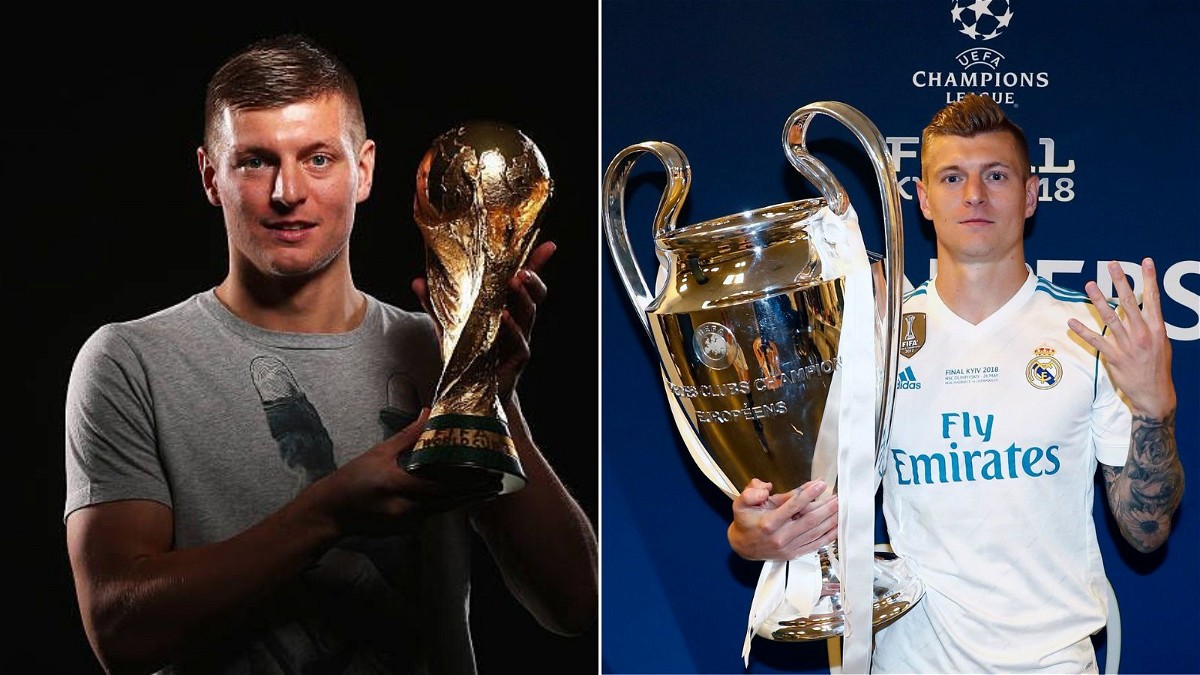 Toni Kroos with World Cup and Champions League trophy